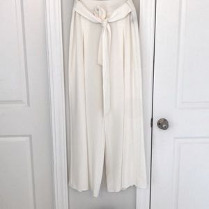 Cream colored pleated pants,  front tie